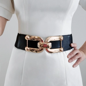Detail showing high-elastic black wide belt with polished gold metal interlocking buckle