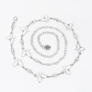 Detail of silver butterfly waist chain with sparkling rhinestones and rose pendant decor