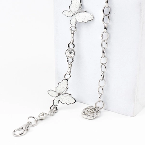 Silver waist chain detail featuring glitter butterflies, clear rhinestone and rose pendant
