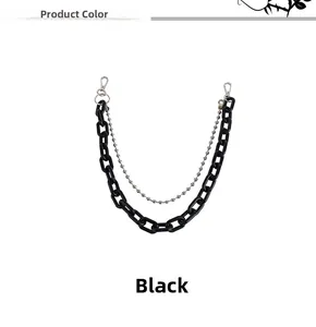 Detail of double-layer punk pants chain with matte black links and silver beaded metal chain