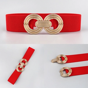 Detail of red elastic waist belt featuring a gold geometric interlocking metal buckle