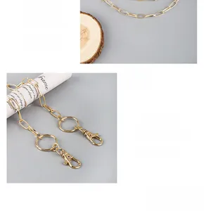 Detail view of the 360-degree rotating lobster clasp and golden chain link accessory