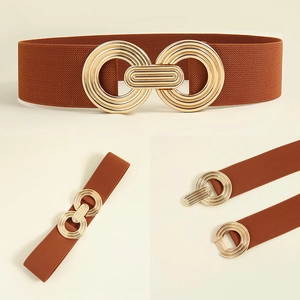 Detail of a brown elastic waist belt for women with interlocking gold geometric metal buckle