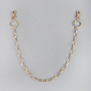 Detail of a gold-tone hip-hop style hollow chain with lobster clasps for pants or bags