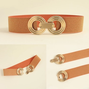 Detail of caramel elastic waist belt with vintage double gold ring metal buckle