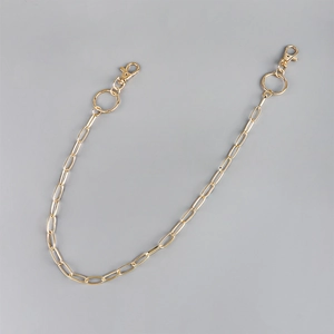 Gold hollow link chain for hip hop punk style with lobster clasp on grey background