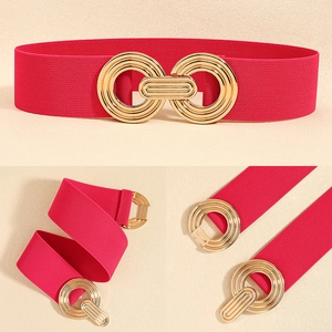 Detail of rose red elastic waist belt featuring a gold geometric interlocking metal buckle