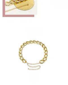 Detail of adjustable golden metal chain belt featuring hollow horseshoe links and extender