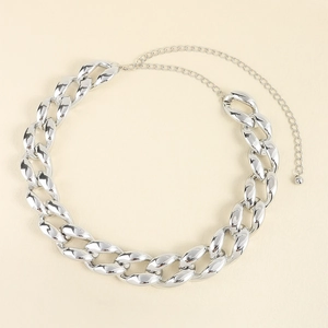 Detailed close-up of polished silver punk chunky chain necklace with lobster clasp hardware