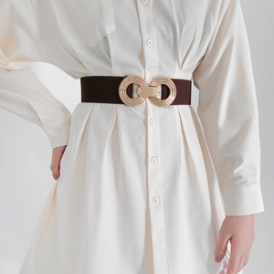 Elastic waist belt for women with geometric gold infinity buckle on dark brown band