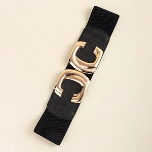 Detail of a wide elastic waist belt for women with a gold metallic C-shape clasp and buckle