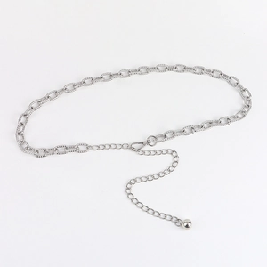 Detail of silver hollow metal waist chain with adjustable lobster clasp and ball pendant