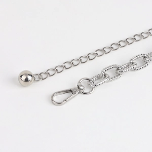 Detail of silver double-layered metal waist chain with ball pendant and lobster clasp