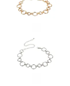 Detail of adjustable golden and silver metal ring chain belt with lobster clasp and extension