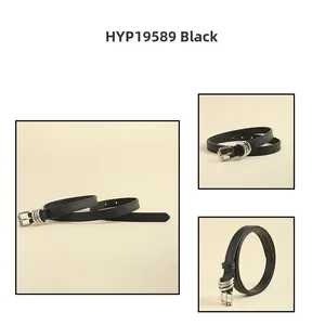 Detail view of thin black punk belt with silver square buckle and triple metal loops