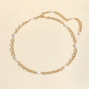 Detail of golden metal waist chain with baroque pearls and lobster clasp closure