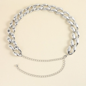 Detailed macro view of large chunky silver alloy link chain with lobster clasp and adjuster