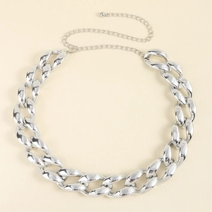 Close-up of a silver chunky Cuban chain belt with adjustable link and small ball charm