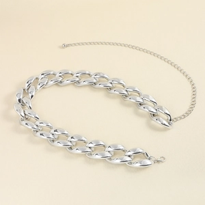 Close-up of polished silver punk cuban chain belt with lobster clasp and adjustable extension