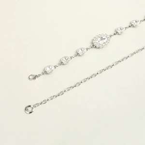 Detail of silver rhinestone waist chain with adjustable lobster clasp and crystal pendant