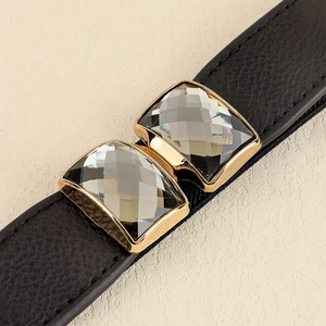 Ceinture noire élastique pour robe avec boucle dorée ornée de grandes pierres de cristal