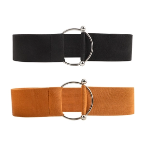 Detail of wide elastic waist belts in black and tan with round silver metal buckles
