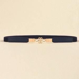 Detailed view of women's navy blue elastic belt with golden knot-style metal buckle