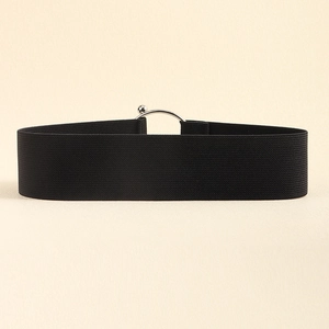 Close-up of black elastic waist belt with silver metal buckle detail on textured background