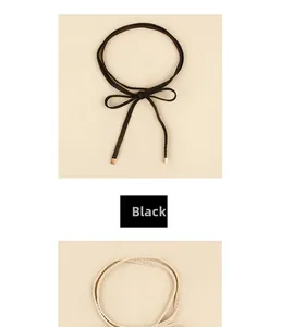 Detail of woven knotted belt with gold metal ends in black and beige color options