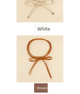 Detailed close-up of woven knot waist belts in white and brown with metallic ends