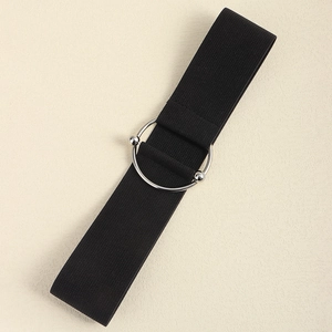 Detail of black elastic waist belt featuring a polished silver metal ring buckle