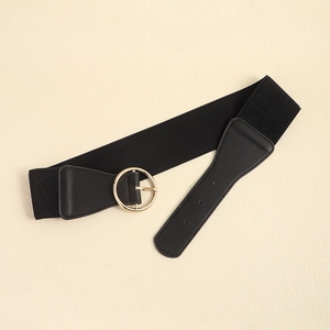 Close-up of circular gold metal buckle and black elastic weave on a wide waist belt