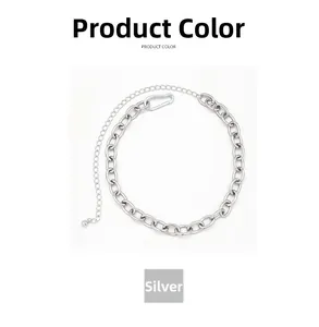 Detail of silver heavy curb chain link belt with lobster clasp and adjustable extension