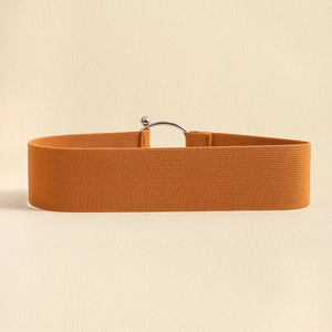 Minimalist wide elastic cinch belt in caramel orange with silver metal ball buckle