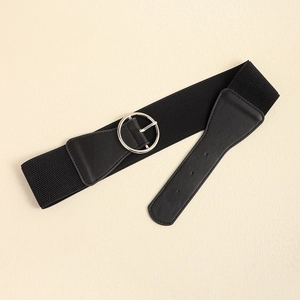 Close-up of black elastic waist belt with silver metal round buckle and faux leather detail