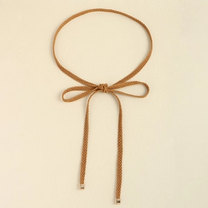 Detail of woven knotted waist rope with premium gold square metal tips for dresses