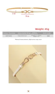 Detail of thin off-white dress belt featuring a gold geometric buckle and twisted design