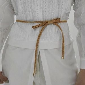 Versatile caramel braided waist rope for women with elegant golden metal ends on white shirt