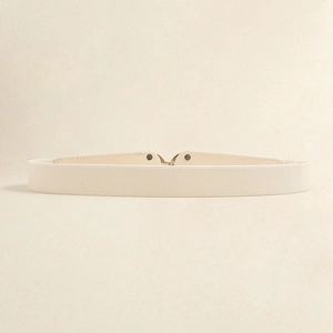 Detail of beige elastic belt with premium woven texture and leather interlocking buckle