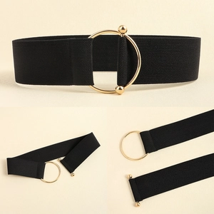 Detail of wide black elastic waist belt with a polished gold circular buckle closure