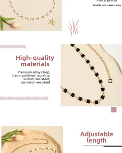 Detail view of adjustable metal waist chain with black and white square drip oil beads
