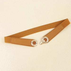 Close-up of brown elastic braided belt with gold round buckle and leather texture