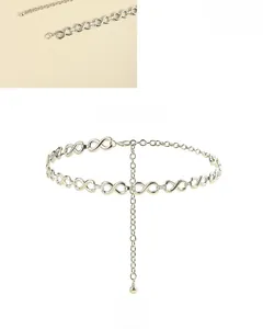 Detailed view of silver chain belt with infinity links and adjustable lobster clasp
