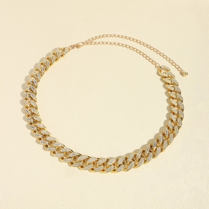 Detail of gold Cuban link belt with sparkling rhinestones and lobster clasp closure