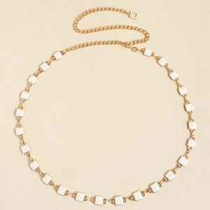 Minimalist gold metal waist chain belt with white square enamel accents for dresses