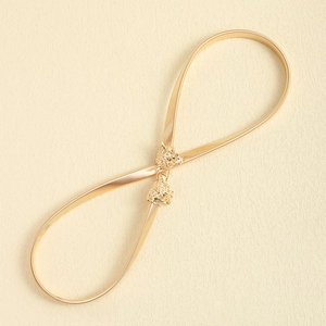 Elegant gold metal waist chain belt featuring detailed double lion head buckle closure