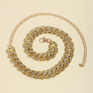 Macro detail of gold curb chain waist belt with rhinestones and adjustable lobster clasp