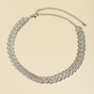 Macro shot of silver Cuban link waist chain with sparkling pavé rhinestones and lobster clasp