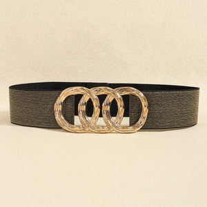 Detail of the golden interlocking triple-ring buckle on a black elastic waist belt