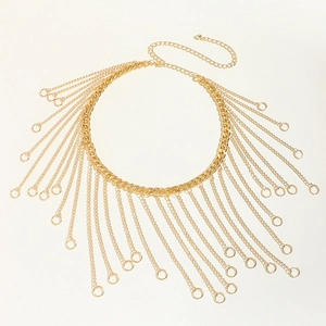 Detailed macro view of layered golden fringe body chain with metallic ring pendants